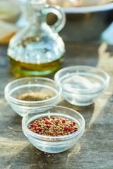 An assortment of spices on the table for cooking. Seasonings for the kitchen