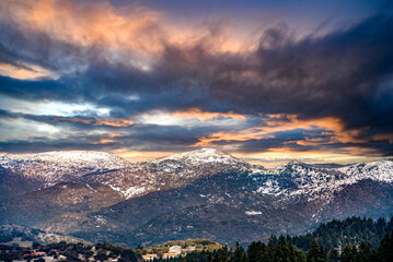 view of snow coated Helmos mountain which located in Peloponnese. Grecce.The photo taken from the opposite mountain named Mainalo
