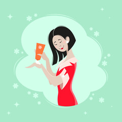Young asian girl in a red dress applies a cosmetic product to her hands