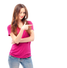 Just look at this! Happy young smiling woman pointing copy space while standing isolated on white