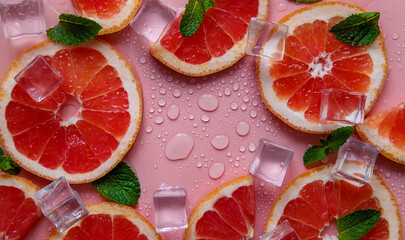 Background with grapefruit and water drops. Selective focus.