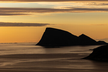 midnight sun from Ornfloya Hiking Trail with island of Haja (Håja) in the background. Sommaroy...