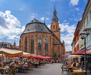 Naklejka na ściany i meble Heidelberg market place and Church of the Holy Spirit in the background. Baden-Württemberg, Germany, , Europe.