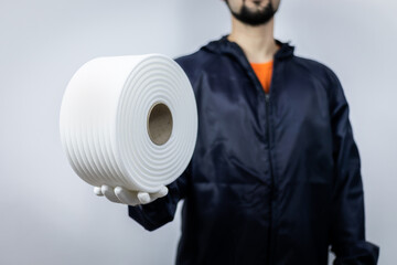 worker keep foam masking type in hand