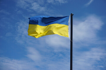 Ukraine flag in the blue sky