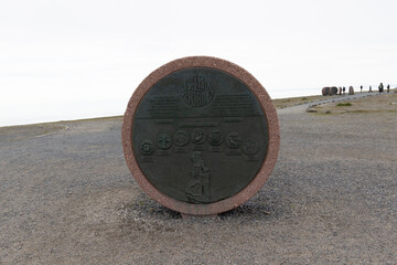 North Cape (Nordkapp), on the northern coast of the island of Mageroya in Finnmark, Northern Norway. Globe that marks the northern point of Europe in a cloudy day