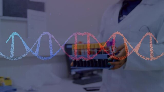 Animation of dna strand over biracial female scientist in lab