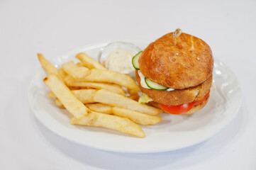 View on white background of french fries with burger. Healthy food, diet lunch concept.