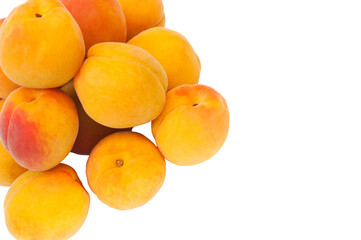 Beautiful apricots on a white texture. Isolated ripe peaches. Juicy white plums on a light background. Fruit growing concept.