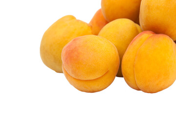 Beautiful apricots on a white texture. Isolated ripe peaches. Juicy white plums on a light background. Fruit growing concept.