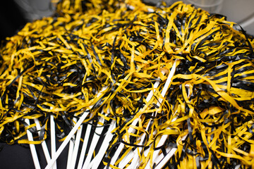 black and gold pom-poms