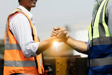 Team Construction or engineering group and worker. Teamwork and determination to succeed. Safety...