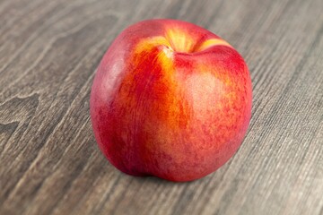 Tasty fresh peach fruit on the desk