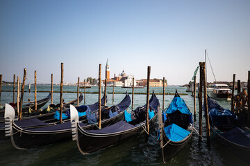 Venetian gondolas lined up in Venice Italy