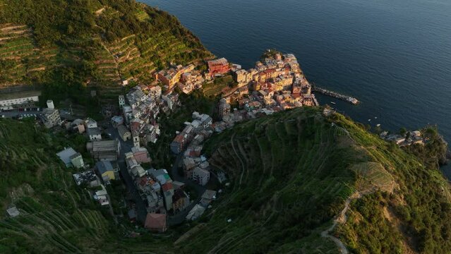 View from above, stunning aerial view of Manarola, the second village of the Cinque Terre coming from La Spezia. Manarola is the most picturesque village, made up of colorful tower-houses.