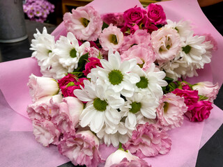Beautiful big pink bouquet with pink roses and white chrysanthemums 