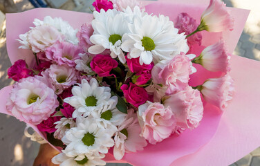 Beautiful big pink bouquet with pink roses and white chrysanthemums 