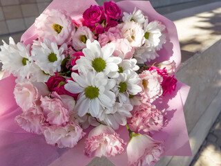 Beautiful big pink bouquet with pink roses and white chrysanthemums 