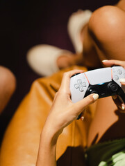 a young girl playing a game on a game console © enginakyurt