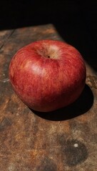 red apple with water drops on the table