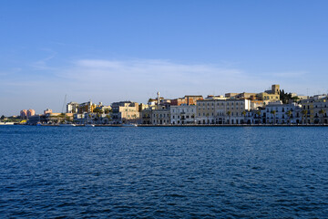 view of the historic center of Brindisi, Italy. Sea view of the skyline