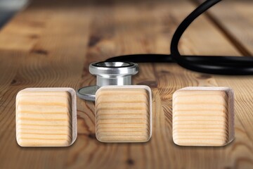 Wooden blocks on the desk. Scientific symbols of the coronavirus evolved from the omicron. The concept of the spread of new mutations of the virus in 2022