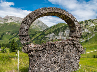 Fototapeta na wymiar art installations interact with the nature of the Dolomites, declared a Natural World Heritage Site by Unesco - Pampeago-Dolomite Trentino, northern Italy