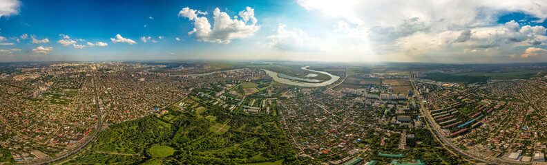 large aerial panorama (340 degrees) of the western outskirts of Krasnodar on a sunny summer day. Arboretum Park and the Kuban River - obrazy, fototapety, plakaty