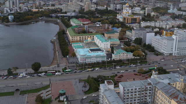 Embankment of the central pond and Plotinka, the historic center of the Yekaterinburg city, Russia. Stock footage. Aerial view of a summer city streets and buildings.