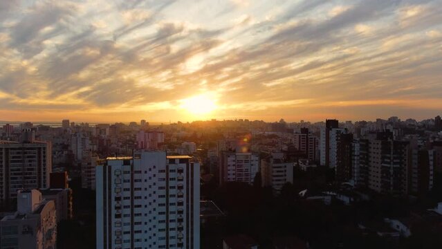 City skyline with a golden sunny afternoon over the city of Porto Alegre with beautiful colored clouds 