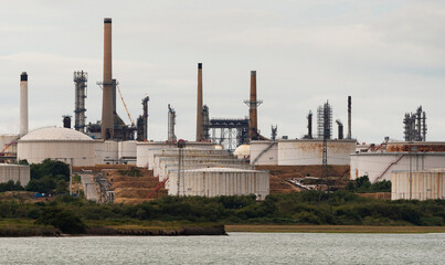 Southampton, southern England, UK. An exterior view of Fawley refinery, storage tanks and chimneys...
