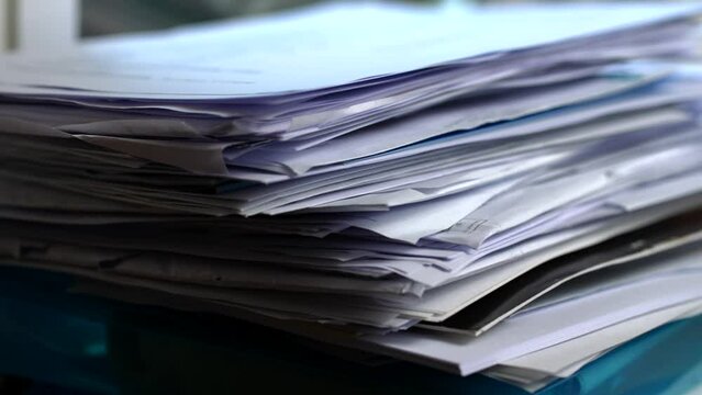 Large Pile Of Papers Dropped On Desk, Too Much Work