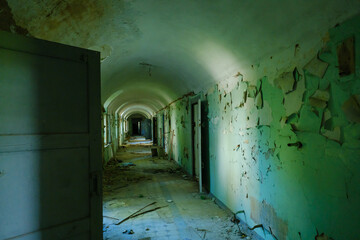 Long hallway with crumbing walls