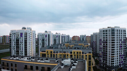 A sunny daytime exterior of a typical upscale apartment building. Stock footage. Aerial view of a summer city street with beautiful buildings.