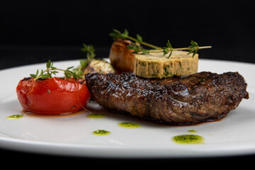 Grilled black angus strip loin steak with vegetables