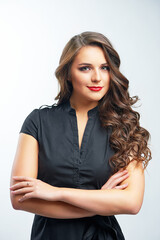 young woman standing with arms crossed over white background