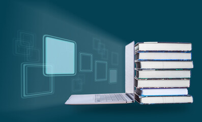stack of books, computer. the concept of education, the light from the screen is a symbol of new knowledge. copy space