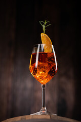 A glass of spritz aperol cocktail decorated with orange on cellar - 520862507
