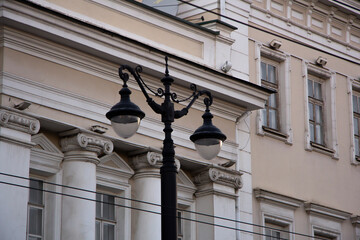 A lamppost in a city park. Source of street light