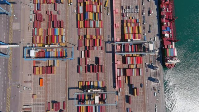 Aerial view over Commercial port with cranes and containers

Drone view over cranes and cargo containers, Haifa,Israel,July,27,2022

