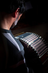 latin man musician playing tango with his bandoneon