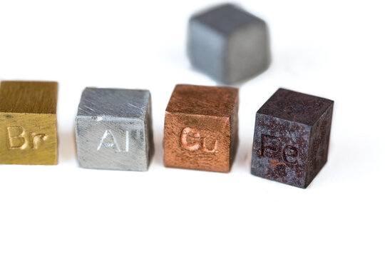 Different metal cubes on pure white background