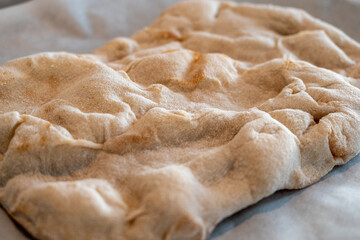 freshly baked homemade yummy pizza dough, square