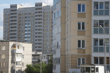 Full-color horizontal photo. Linear geometric composition. An inanimate landscape of parts of the facades of city buildings.