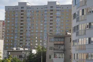 Full-color horizontal photo. Linear geometric composition. An inanimate landscape of parts of the facades of city buildings.