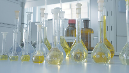 Laboratory test tubes for analysis. Action. Laboratory flasks and test tubes with liquid for...