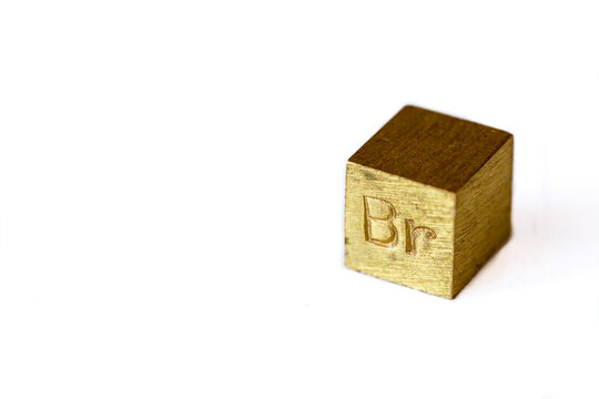 Brass cube with alloy name Br on it on white background