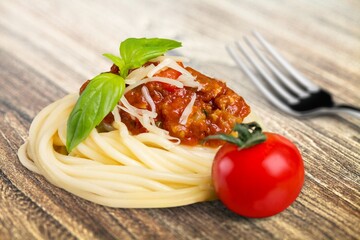 Classic Italian Pasta Spaghetti with wooden table background. Simple and easy vegetarian dish.