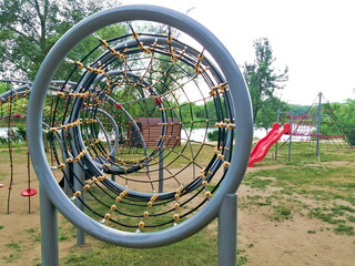 children's rope swings on the street. Children's playground with rope pipe for exercise....