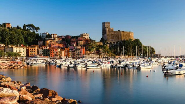 Panoramic Day to Night Sunset Time Lapse of Porto di Lerici and Castello di Lerici with many boats, Lerici, Liguria, Italy